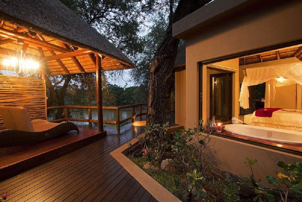Naledi Bush Lodge lantern-lit pathway at dusk