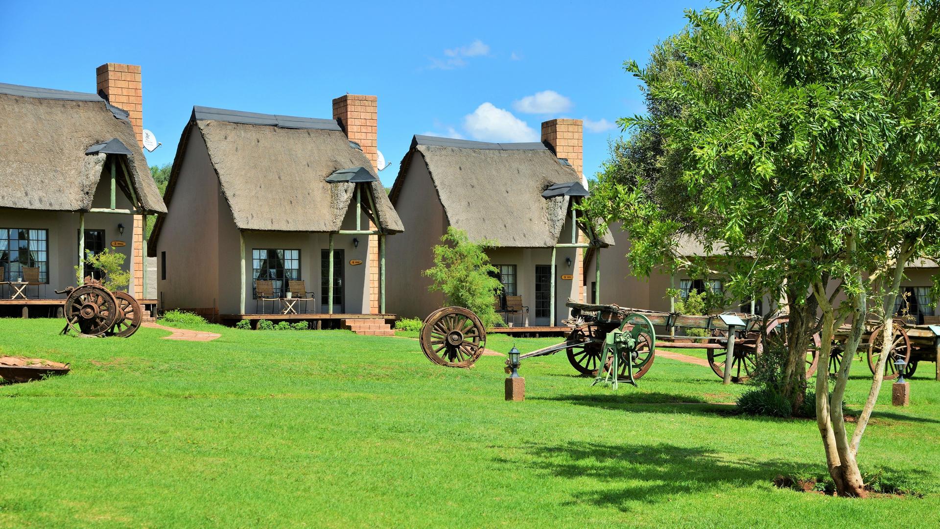 Thatched chalets at African Hills Safari Lodge and Spa, Magaliesberg